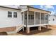 Home's screened porch with brick foundation and convenient access stairs at 120 Lane Farms Way Way, Holly Springs, NC 27540