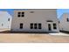 Rear exterior view of new construction two-story home with white siding and minimal landscaping at 1233 Dimaggio Dr # 7, Raleigh, NC 27616