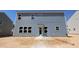 The back of the two story home has light blue horizontal siding and many windows at 1240 Dimaggio Dr # 35, Raleigh, NC 27616