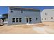 The back of the two story home has light blue horizontal siding and many windows at 1240 Dimaggio Dr # 35, Raleigh, NC 27616