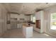 Spacious kitchen featuring white cabinets and a center island at 1240 Dimaggio Dr # 35, Raleigh, NC 27616