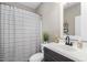 Charming bathroom with striped shower curtain and a modern vanity, creating a fresh and clean aesthetic at 1255 Trollinger Rd, Graham, NC 27253