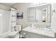 Bathroom featuring granite vanity, a tub-shower combo, and modern fixtures at 1620 Oakland Hills Way, Raleigh, NC 27604