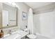 Bathroom with granite vanity top, framed mirror, and shower with curtain at 1620 Oakland Hills Way, Raleigh, NC 27604