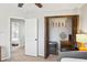 Cozy bedroom showcasing closet, modern lighting, ceiling fan, and neutral walls at 1620 Oakland Hills Way, Raleigh, NC 27604