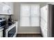 Modern kitchen featuring stainless steel appliances and sleek countertops providing an ideal cooking space at 1620 Oakland Hills Way, Raleigh, NC 27604