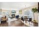 Bright open-concept living area with a fireplace, dining table, and natural light at 1620 Oakland Hills Way, Raleigh, NC 27604