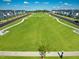 View of green space common area surrounded by houses at 21 Nimble Way # 176, Clayton, NC 27520