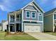Charming two-story home with a two-car garage and a covered porch offers curb appeal at 21 Nimble Way # 176, Clayton, NC 27520