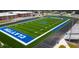 Aerial view of football field with black track at 21 Nimble Way # 176, Clayton, NC 27520