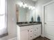 Bathroom featuring double sink vanity with granite countertop at 2218 Christian Light Rd, Fuquay Varina, NC 27526