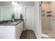 Bathroom featuring double sink vanity, granite countertops and a tiled shower at 2218 Christian Light Rd, Fuquay Varina, NC 27526
