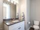 Half bathroom with granite countertop, stylish sink, and modern fixtures at 2218 Christian Light Rd, Fuquay Varina, NC 27526