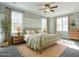 Bright bedroom with large windows, neutral tones, and a decorative bedframe at 2218 Christian Light Rd, Fuquay Varina, NC 27526