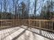 Spacious outdoor deck with wood flooring overlooking a natural landscape at 2218 Christian Light Rd, Fuquay Varina, NC 27526