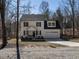 Charming 2-story home with a one car garage and a front porch in a wooded area at 2218 Christian Light Rd, Fuquay Varina, NC 27526