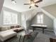 Spacious living room featuring comfortable seating, large windows, and an entertainment area at 2218 Christian Light Rd, Fuquay Varina, NC 27526
