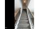 Carpeted staircase with modern black railings and hardwood accents at 2218 Christian Light Rd, Fuquay Varina, NC 27526
