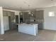 Spacious kitchen with a large island and gray cabinets, ready for customization at 249 Tidal Pool Way, Cary, NC 27519