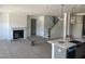 Spacious living room features a fireplace, open layout, and staircase access at 249 Tidal Pool Way, Cary, NC 27519