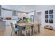 Well-lit kitchen featuring an island, pendant lighting, stainless steel appliances, and a modern open design at 253 Tidal Pool Way, Cary, NC 27519