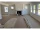 Open-concept living room featuring a fireplace, recessed lighting, and plenty of natural light at 253 Tidal Pool Way, Cary, NC 27519