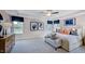 Spacious main bedroom boasts stylish furniture, ample natural light, and tray ceiling at 253 Tidal Pool Way, Cary, NC 27519