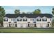 Newly constructed townhomes featuring a blend of modern design with private garages and a sleek black roof at 309 Cherry Laurel Dr, Sanford, NC 27332