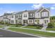 Charming townhomes with a blend of gray and white exteriors, complemented by well-manicured front lawns at 320 Church St # 40, Wendell, NC 27591