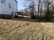 Expansive backyard with a deck and lush green grass, ideal for outdoor activities and relaxation at 3204 Overlook Ct, Burlington, NC 27215