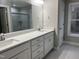 Bathroom featuring a double sink vanity, large mirror, and tile floors at 3204 Overlook Ct, Burlington, NC 27215