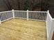 New wooden deck with white railing, perfect for outdoor entertaining and enjoying the surrounding views at 3204 Overlook Ct, Burlington, NC 27215