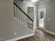 Hallway featuring staircase, and backdoor to deck, all with neutral walls and flooring at 3204 Overlook Ct, Burlington, NC 27215