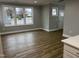 Bright living room featuring hardwood floors, neutral walls, and large windows providing ample natural light at 3204 Overlook Ct, Burlington, NC 27215