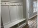Mudroom featuring a built in bench and hooks with neutral walls and wood-look flooring at 3204 Overlook Ct, Burlington, NC 27215