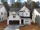 Charming two-story home with an attached garage and a modern design at 3283 Roundly Rd # 12, New Hill, NC 27562