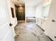 Well-lit bathroom with double vanity, free-standing tub, and separate shower at 3287 Roundly Rd # 13, New Hill, NC 27562