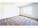 Spacious carpeted bedroom with natural light from a bright window at 3287 Roundly Rd # 13, New Hill, NC 27562