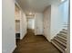 Spacious home entryway with hardwood floors, a staircase, and a view into other rooms at 3287 Roundly Rd # 13, New Hill, NC 27562
