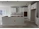 Unfinished kitchen with white cabinets and an island framework at 3287 Roundly Rd # 13, New Hill, NC 27562