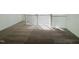 Upstairs landing area with neutral carpet, natural light, and white railing at 3287 Roundly Rd # 13, New Hill, NC 27562