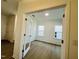 Bright home office with a pair of glass panel doors, a hardwood floor, and plenty of natural light at 3287 Roundly Rd # 13, New Hill, NC 27562