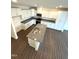 Modern kitchen boasting granite counters, stainless steel appliances, white cabinets, and hardwood floors at 343 Church St # 66, Wendell, NC 27591