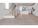 Open-concept living space with a kitchen island, and hardwood floors at 343 Church St # 66, Wendell, NC 27591