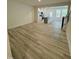 Spacious living room open to the kitchen, featuring wood-look floors and natural light. 97 characters at 343 Church St # 66, Wendell, NC 27591