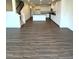 Open-concept living space with hardwood floors connecting the living room, kitchen, and staircase at 343 Church St # 66, Wendell, NC 27591