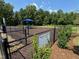 Well-maintained dog park with a shaded area and secure fencing for your furry friends at 345 Church St # 65, Wendell, NC 27591