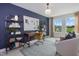 This office space features blue accent wall, modern shelving, and an abundance of natural light at 347 Church St # 64, Wendell, NC 27591