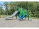 Community playground with blue and green play structure, slide, steps, and mulch ground covering at 347 Church St # 64, Wendell, NC 27591