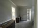 Bathroom with gray tile floor, double vanity, and doorways to water closet and walk-in closet at 395 Meadow Walk Dr, Fuquay Varina, NC 27526
